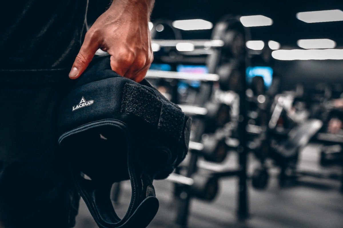 a person holding a black bag