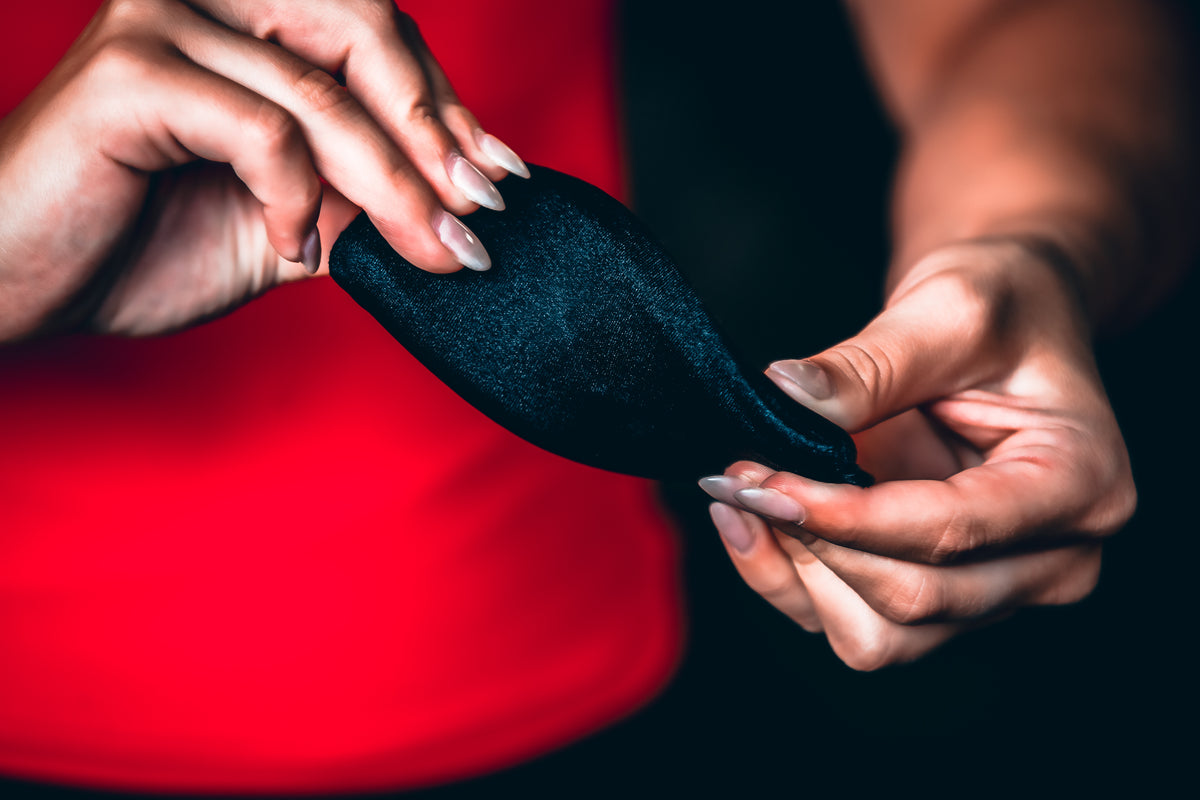 a person holding a black object